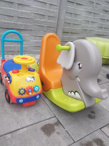 a toy elephant and a toy car on a sidewalk at Wellness Villa Diana in Boldogkőváralja