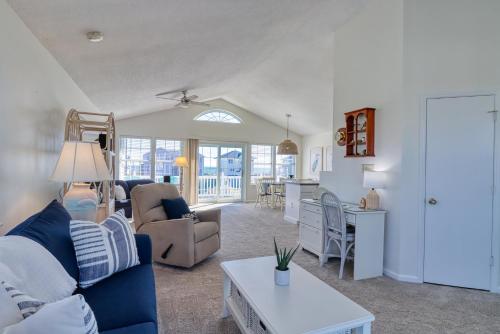 a living room with a couch and a table at Comfort and Sun at Tranquility Cay in North Topsail Beach