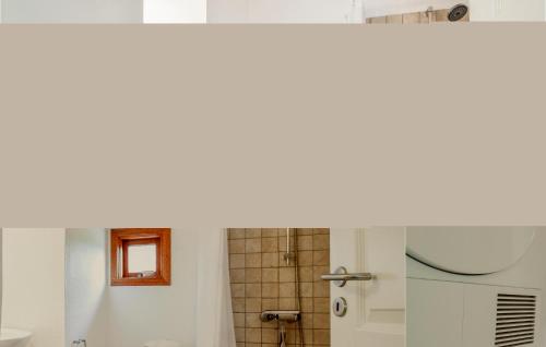 a bathroom with a sink and a shower at Holiday Home Bellisvej Tranekær Ix in Skattebølle