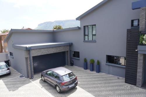 a car parked in front of a garage at The Raz in Harrismith