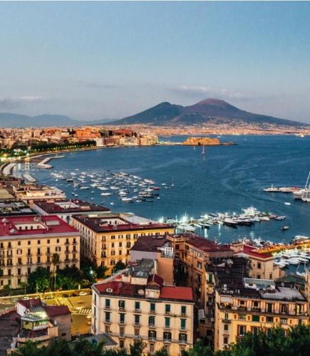 a view of a city with boats in the water at Maison Azzurra in Naples