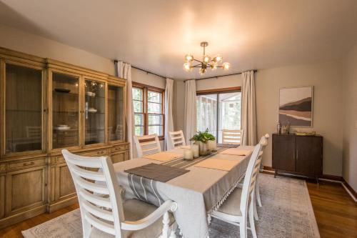 a dining room with a table and white chairs at Pet-Friendly Retreat~$375 Free Activities Daily in Hendersonville