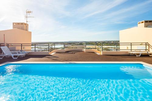 a swimming pool on the roof of a house at Green House - Pool on Rooftop in Olhão