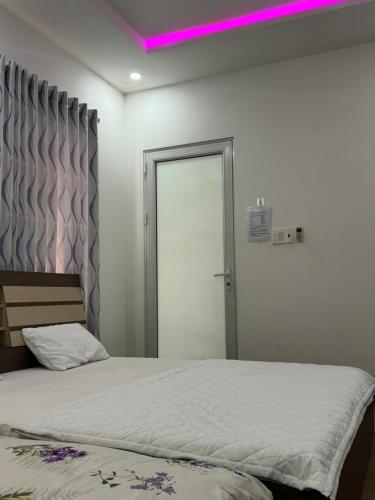 Ένα ή περισσότερα κρεβάτια σε δωμάτιο στο Home Sun Moon - Phòng Đôi