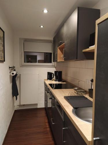 a kitchen with a sink and a counter top at Kleine Auszeit in Cochem
