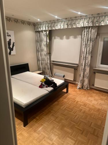 a bedroom with a bed and a projection screen at Zimmer in Oberhausen