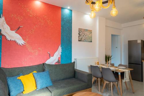 a living room with a couch and a table at Kostis Orange Resort in Volos