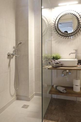 a bathroom with a shower and a sink at Central House in Plaka in Athens