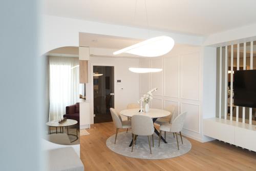 a dining room with a table and chairs at Adria Concept Suites in Zadar