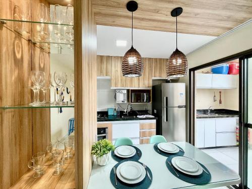 a kitchen with a table with plates on it at Resort VG SUN por Be My Guest! in Caucaia