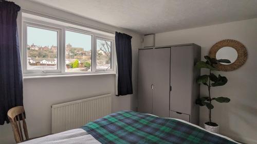 Ένα ή περισσότερα κρεβάτια σε δωμάτιο στο The Boathouse, Rye