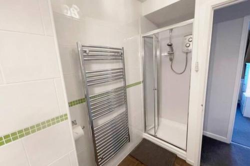 a bathroom with a shower and a walk in shower at Torquay in Torquay