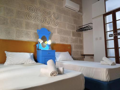 Llit o llits en una habitació de Limestone Sun Suites