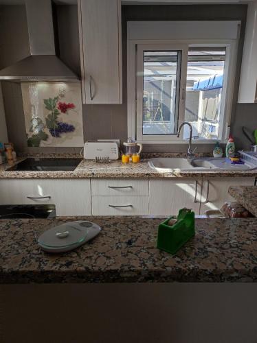 a kitchen with a sink and a counter top at Villa stamalmar in Villaricos