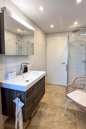 a bathroom with a sink and a shower at Oliveres3 in L'Ampolla