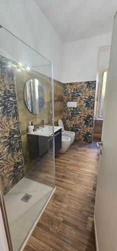 a bathroom with a shower and a toilet and a sink at La Passeggiata in Monterotondo