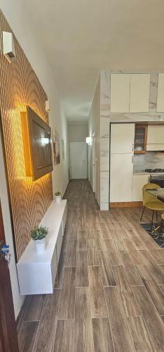 a room with a kitchen and a living room at La Passeggiata in Monterotondo