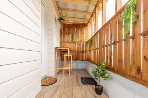 a hallway of a house with wooden walls and wooden floors at Au Doux Refuge - Maison - Parking gratuit in Romorantin