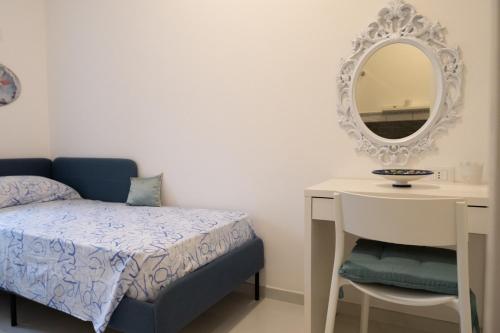 Ένα ή περισσότερα κρεβάτια σε δωμάτιο στο Montalbino House - Rooms and Apartments