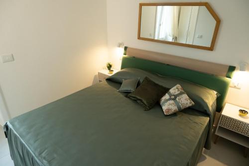 Ένα ή περισσότερα κρεβάτια σε δωμάτιο στο Montalbino House - Rooms and Apartments