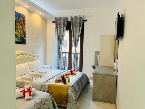 A bed or beds in a room at Santa Maria Accommodation