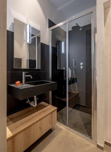 a bathroom with a sink and a shower at Respiro Greco in Syracuse