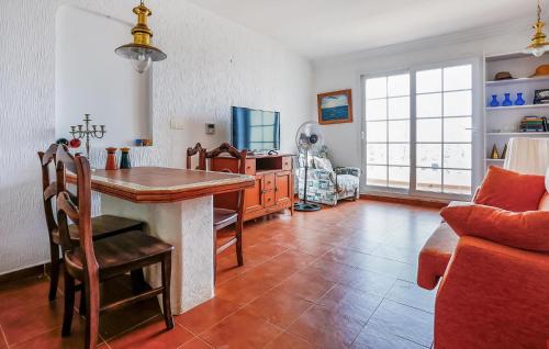 a living room with a table and a couch at Awesome Apartment In Torrevieja in Torrevieja