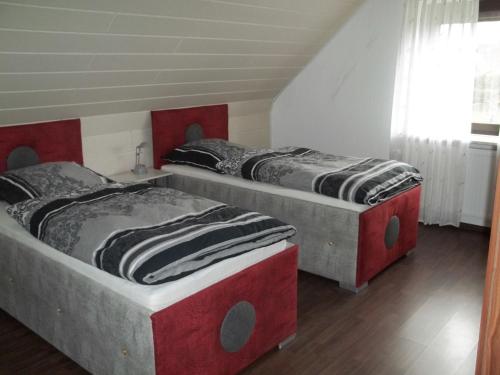 Кровать или кровати в номере Ferienwohnung Berne