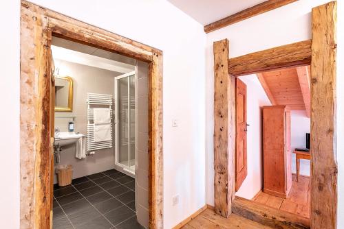 a bathroom with a toilet and a sink at Weisses Kreuz - Crusch Alva in Samedan