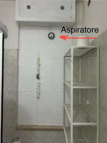 a room with a shower with a white wall at The Angels House in Fossacesia
