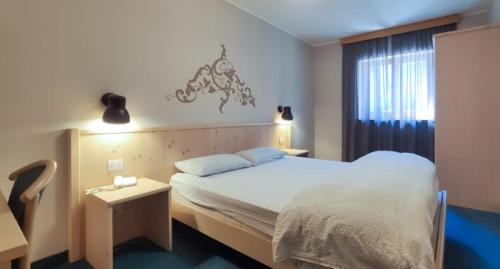 Letto o letti in una camera di Hotel Principe Marmolada