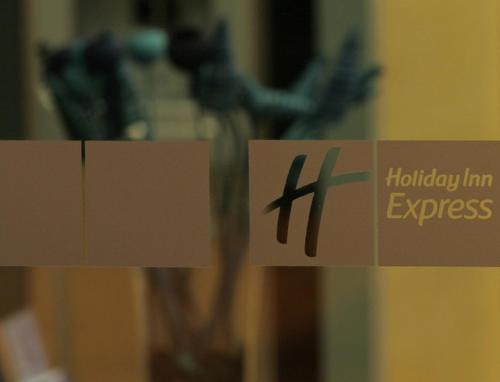 a sign with the words holiday inn express on it at Hotel Holiday Inn Express Madrid-Rivas by IHG in Rivas-Vaciamadrid