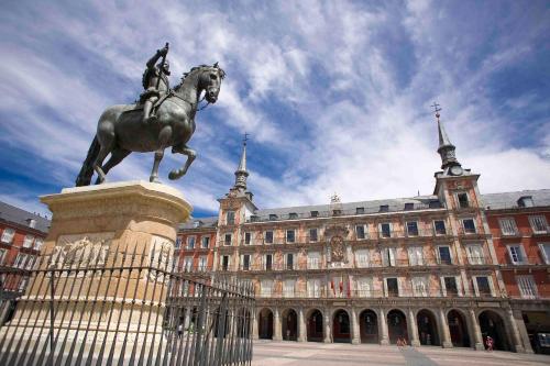 a statue of a man riding a horse in front of a building at Hotel Holiday Inn Express Madrid-Rivas by IHG in Rivas-Vaciamadrid