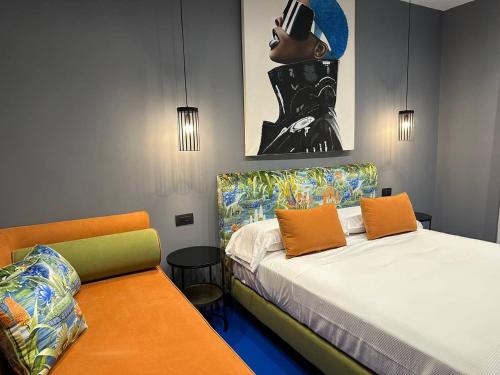 Postel nebo postele na pokoji v ubytování Sorrento Rooms Deluxe