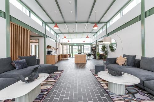 a lobby with couches and tables in a building at The Lookout in Dublin