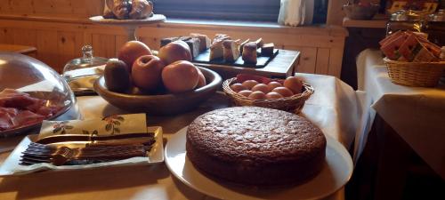 a table with a chocolate cake and eggs on it at Hotel Gran Baita in Gressoney-Saint-Jean