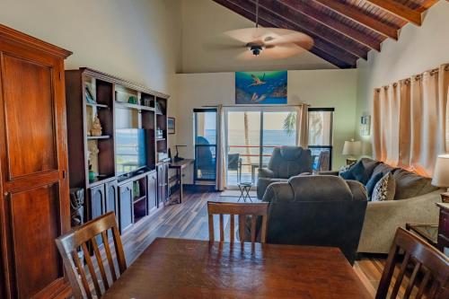 a living room with a couch and a table at Tres Cocos Resort in San Pedro