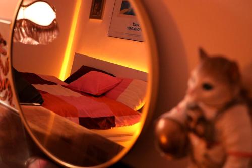 a small child looking at a mirror in a bedroom at Kato Flat Center in Katowice