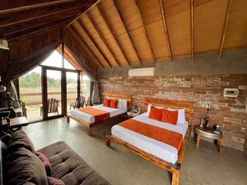 Cama o camas de una habitación en Don Tomas Viñedo cabañas
