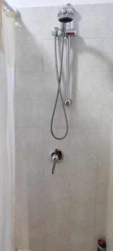 a shower in a bathroom with a shower head at Dimora Nonna Angela in Alberobello