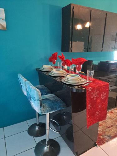 a table with plates and glasses on top of it at Seashells in Nassau