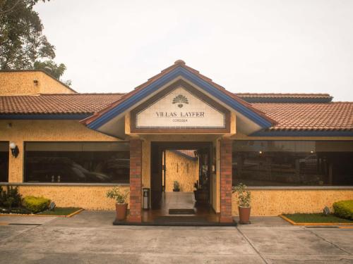 a building with a sign that reads wmis interpreter at Villas Layfer, Córdoba, Veracruz, Mexico in Córdoba