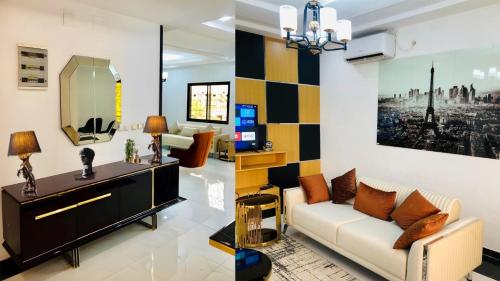 a living room with a couch and a mirror at SkyLight Residence in Yaoundé