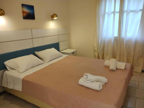 A bed or beds in a room at Vanilla House Paleokastritsa