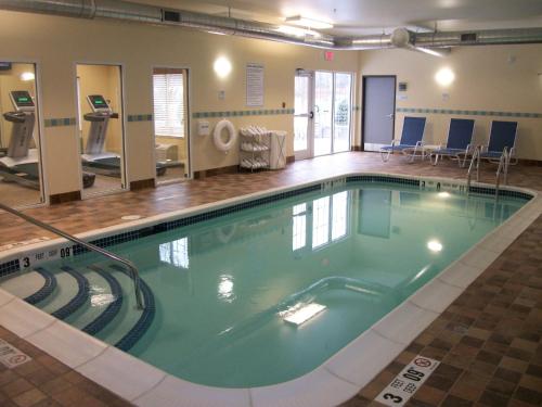 a large swimming pool in a hospital room at Holiday Inn Express - Cortland, an IHG Hotel in Cortland