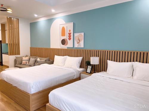 TMS Beachfront Quy Nhon Apartmentにあるベッド
