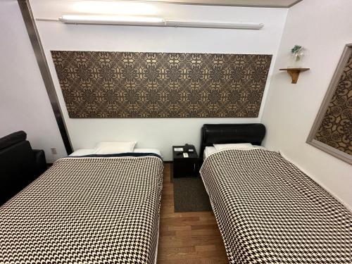 Tempat tidur dalam kamar di Hotel Rakusai