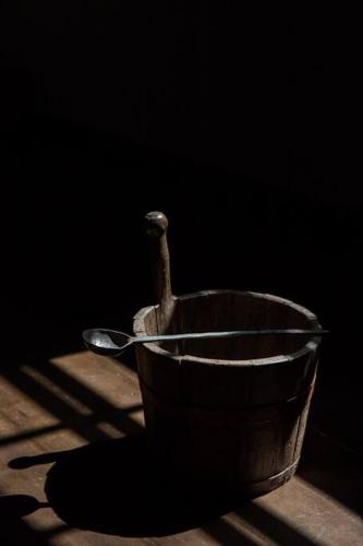 a wooden bowl with a bird on a table at SABI Award Winning Designer Cabin in Binalong Bay