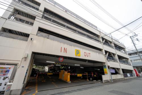 a building with an in b out sign on it at Hotel Ace Morioka in Morioka