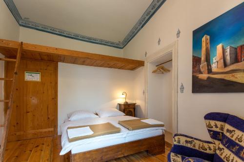 a bedroom with a bed and a painting on the wall at Burg Plankenstein in Texing